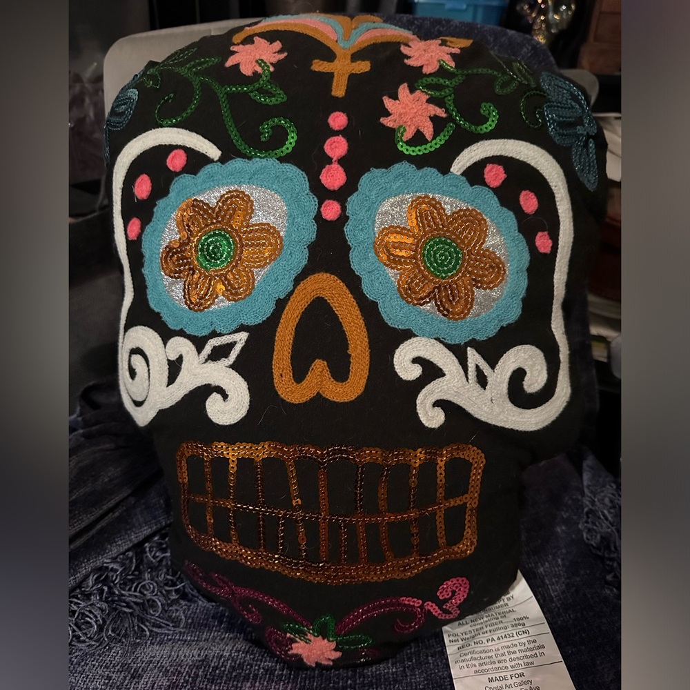 Sequined Sugar Skull pillow with black background.